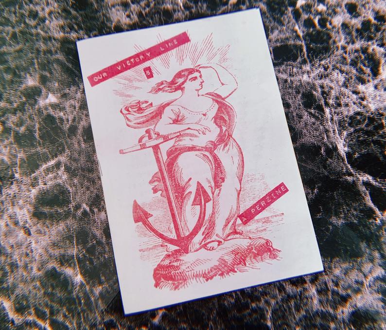 Our Victory Line 5 (Lou Viner). A picture of Lou's zine. It is printed in bright pink ink, with an image of a woman in ancient-style dress looking out to sea, next to an anchor.